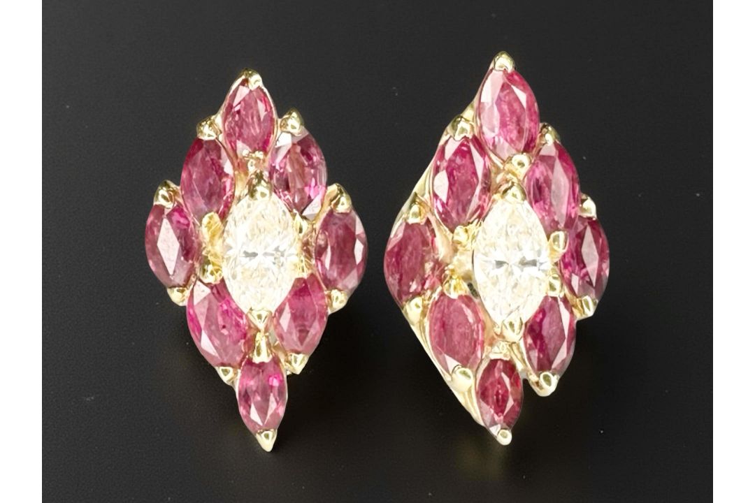 A fine quality pair of 18ct yellow gold ruby and diamond earrings.