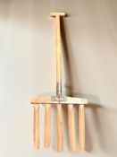 A vintage rustic wooden hay fork with iron makers plaque signed R Boby ltd Bury St.