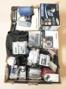 A group of digital cameras and video cameras including Samsung, Poloroid,
