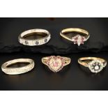 Five 9ct gold rings set with diamonds,