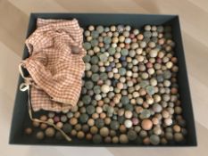 A box of antique pottery and glass marbles