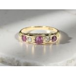 An 18ct yellow gold ruby and diamond ring, size N. CONDITION REPORT: 2.