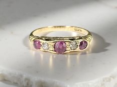 An 18ct yellow gold ruby and diamond ring, size N. CONDITION REPORT: 2.