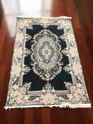 A machine made rug of Iranian design,