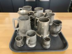 A group of antique pewter tankards