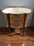 A French Kingwood veneered and gilt metal mounted two drawer chest, with galleried marble inset top,