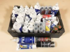 Assorted bottles of PVA glue, furniture varnish, grout, metallic paint,