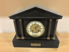 A black slate eight day mantel clock,
