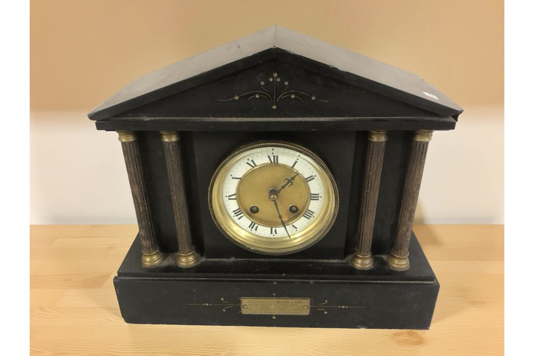 A black slate eight day mantel clock,