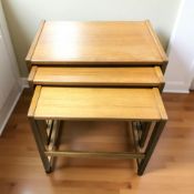 A nest of three teak tables,