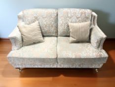 A good quality Victorian style two seater settee in two tone floral upholstery,