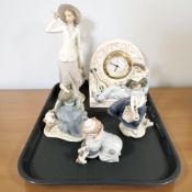 A Lladro quartz mantel timepiece numbered 5778 and four further Lladro figures