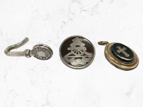 A silver and tortoiseshell Royal Artillery brooch together with a Georgian mourning locket and a