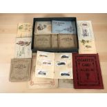 A collection of cigarette cards in albums
