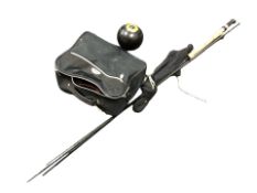 A bag of lawn boules and a Shimano power loop fly fishing rod