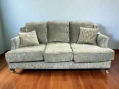 A good quality Victorian style three seater settee in two tone floral upholstery,