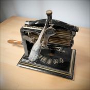 A cast iron Crown fabric crimper,