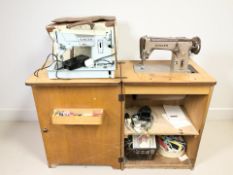 A sewing work table containing a Singer 306K electric sewing machine,