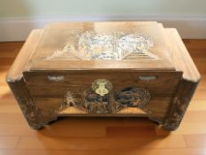 An oriental carved camphor wood chest,