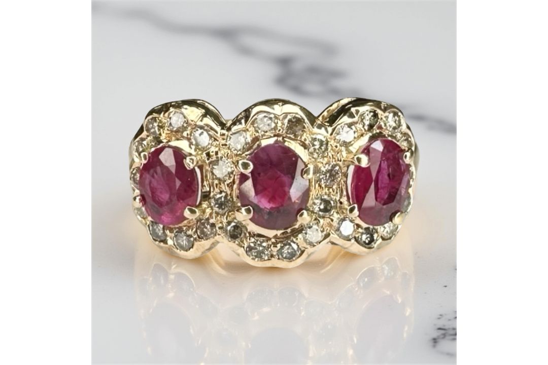 An 18ct gold ruby and diamond ring, size M CONDITION REPORT: 3.