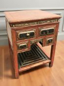 A 19th century Chinese red lacquered and gilt elm four drawer square side table with under shelf,