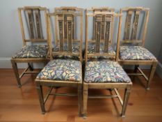 A set of six Edwardian oak dining chairs in contemporary Arts and Crafts upholstered seats
