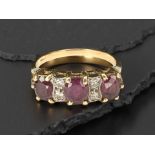 An 18ct gold ruby and diamond ring, size M CONDITION REPORT: 3.