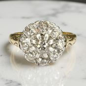 An antique 18ct gold diamond cluster ring, approximately 1.4ct, size R.