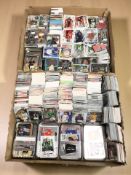 A large quantity of football trading cards including Panini and Tops (2 boxes)