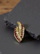An 18ct gold ruby and diamond pendant, approximately 2.9cts.