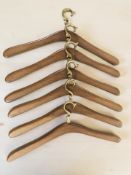 Six Danish 20th century teak and brass coat hangers