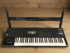 A Korg EX 3 T3 music work station with folding stand,