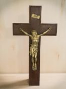 A wooden and gilt metal crucifix,
