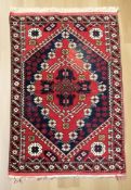 An Iranian geometric woolen rug,