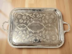 A large silver plated twin handled rectangular serving tray, width 75 cm.