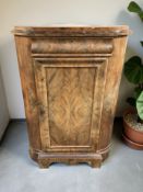 A 19th century continental walnut single door corner cabinet, height 139 cm.