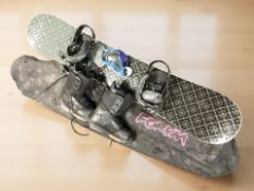 A snow board, pair of ski boots size 9.