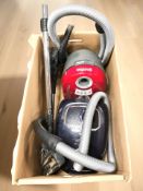 A Nilfisk vacuum cleaner and a Bosch vacuum cleaner (continental plugs,