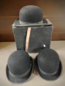 Three gent's black felt bowler hats retailed by Lock & Co, St James' Street, London,