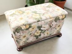 An upholstered sarcophagus storage ottoman on mahogany bun feet, width 94 cm.