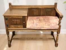 An oak linen fold telephone seat,