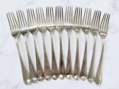 A set of eleven George III silver table forks, maker indistinct, London 1802.