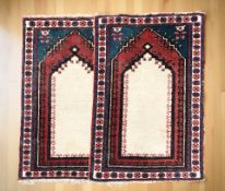 A pair of Iranian prayer rugs,