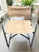 A Scandinavian chrome framed armchair, with canvas sling seat and back rest.