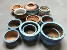 Approximately eighteen earthenware garden planters