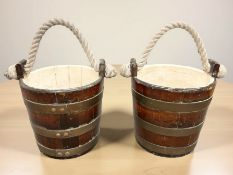 A pair of George III mahogany and brass-banded peat buckets, with rope carrier handles,