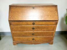 A 19th century continental oak fall front bureau, 118 cm x 56 cm x 110 cm.