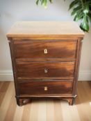 A late 19th century continental mahogany three drawer chest,