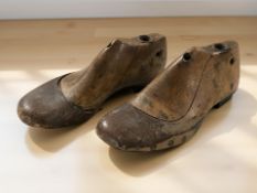 A pair of antique child's wooden shoe lasts, length 17 cm.