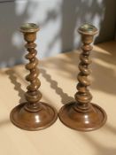 A pair of Victorian turned walnut barley twist candlesticks, height 27 cm.